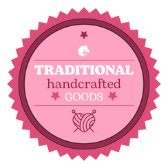 Pink Traditional handcrafted goods seal with a yarn heart