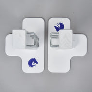 Top view of the two white cross-shaped feet with blue horse head logos and the metal hooks on the stands