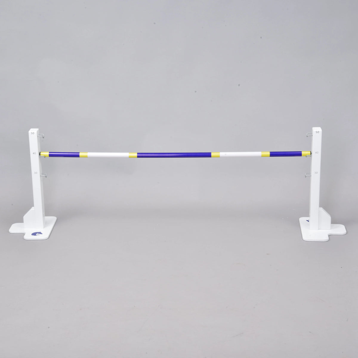 LarDen Hobby Horse Jump with a blue, white and yellow pole on two low white stands with height marks from 30 to 50 cm
