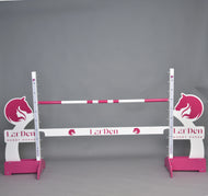 Hobby Horse LarDen jump with pink horse head wings, pink feet, a pink and white pole and a white filler board
