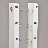 Tops of the two tall stands with 100, 110 and 120 cm marks, metal hooks and a small pink horse logo