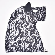 Hobby Horse protective suit Black & White laid flat: one black ear, eye opening and drawstring with toggle at the bottom