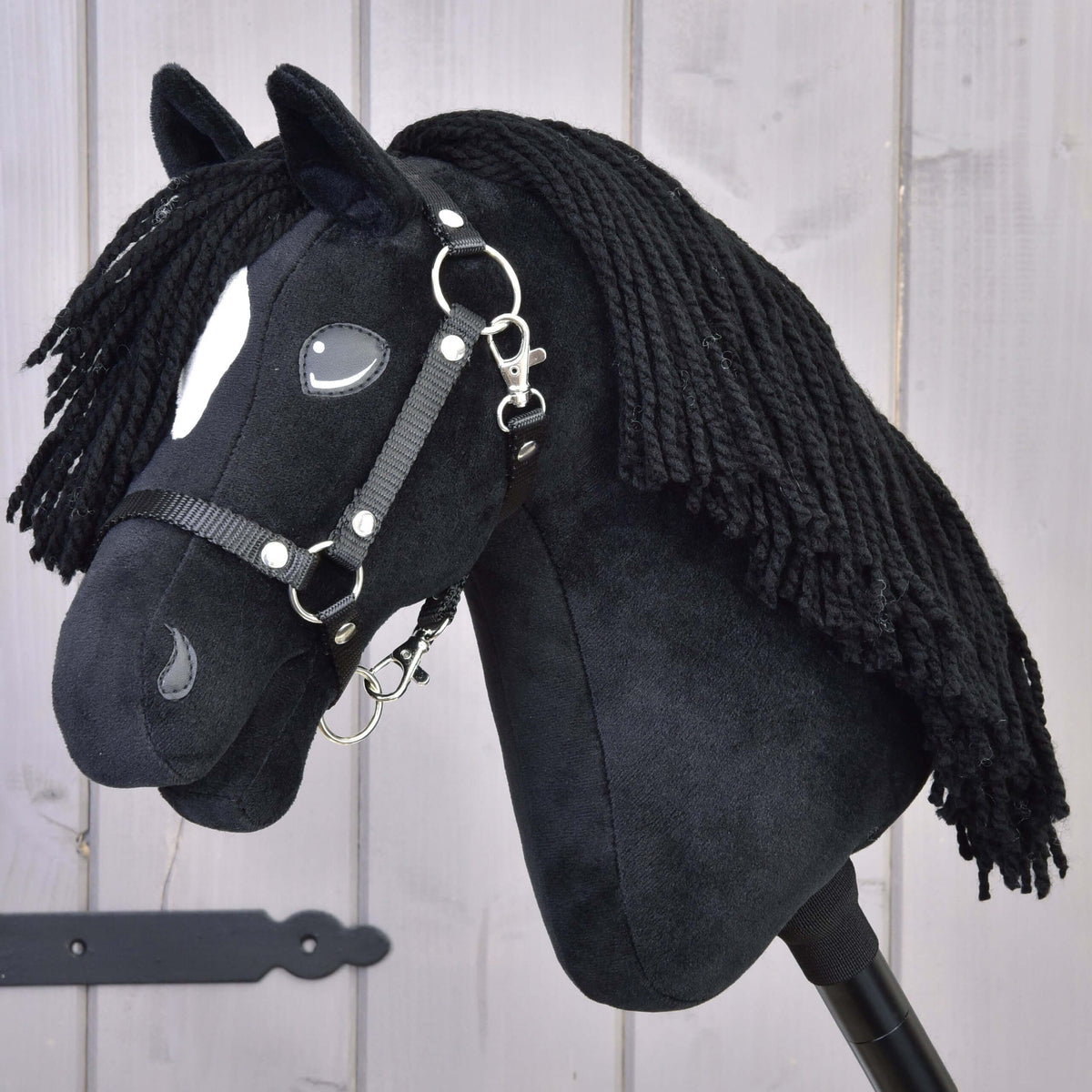 Hobby Horse Cloony with Black Halter by LarDen, a black plush head with a white star and a long black yarn mane