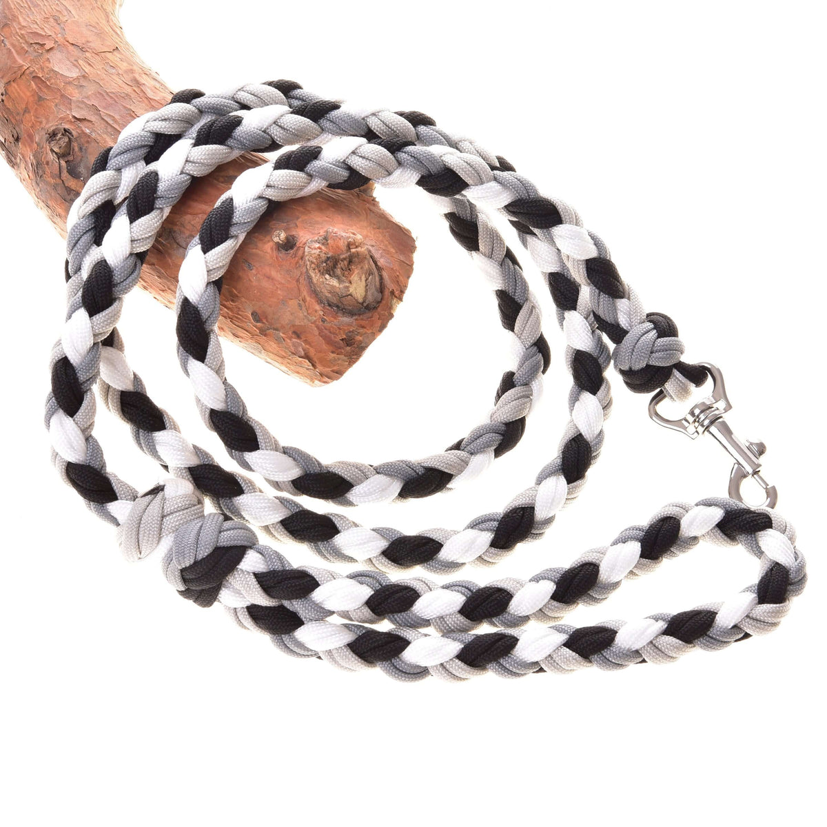 Hobby Horse Braided lead rope black/white by LarDen in black, white and grey cord with a snap hook, on a branch