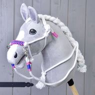 Grey plush Hobby Horse wearing the white rope halter with pink and blue braided noseband and matching white reins