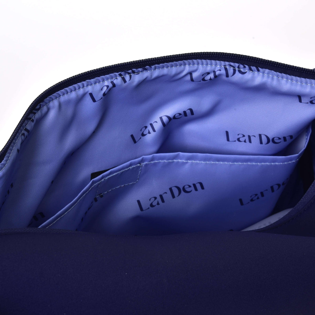 Inside the Hobby Horse Sports bag: lilac lining printed with LarDen lettering and an inner slip pocket