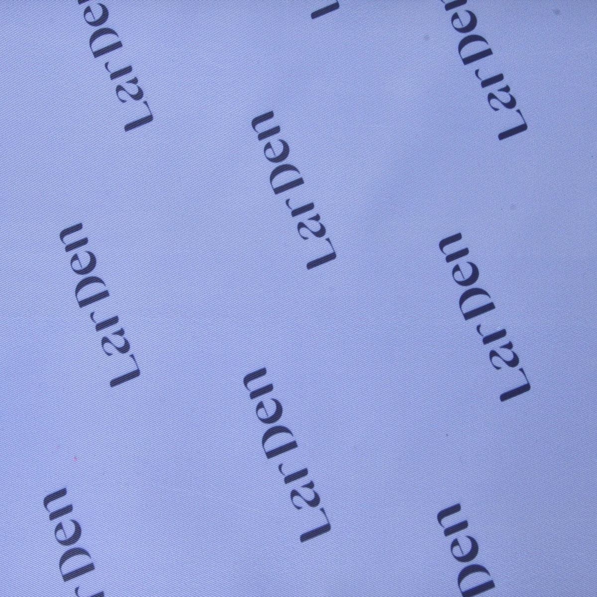 Close-up of the pale lilac lining fabric of the Hobby Horse Sports bag, printed all over with dark LarDen lettering