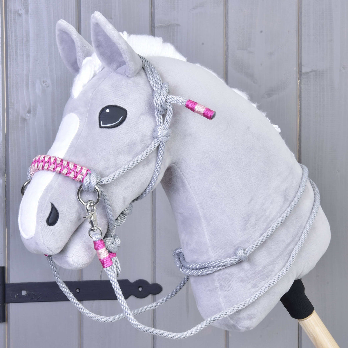 Grey plush Hobby Horse wearing Rope set Rosie: grey rope halter with pink braided noseband and matching grey reins