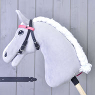 LarDen Bridle with 2 Headbands Pink on a grey plush Hobby Horse, black straps with a plain pink browband