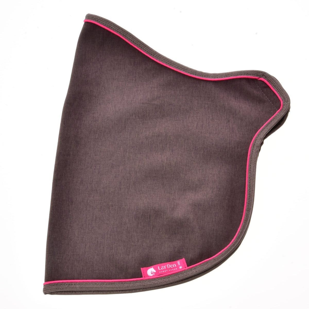La couverture Palissandre posée à plat de côté, marron foncé à passepoil rose vif avec étiquette LarDen rose en bas