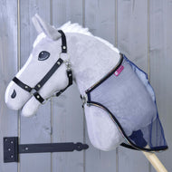 Grey Hobby Horse in a black halter wearing the sheer navy mesh fly sheet, fastened at the chest with a silver clip