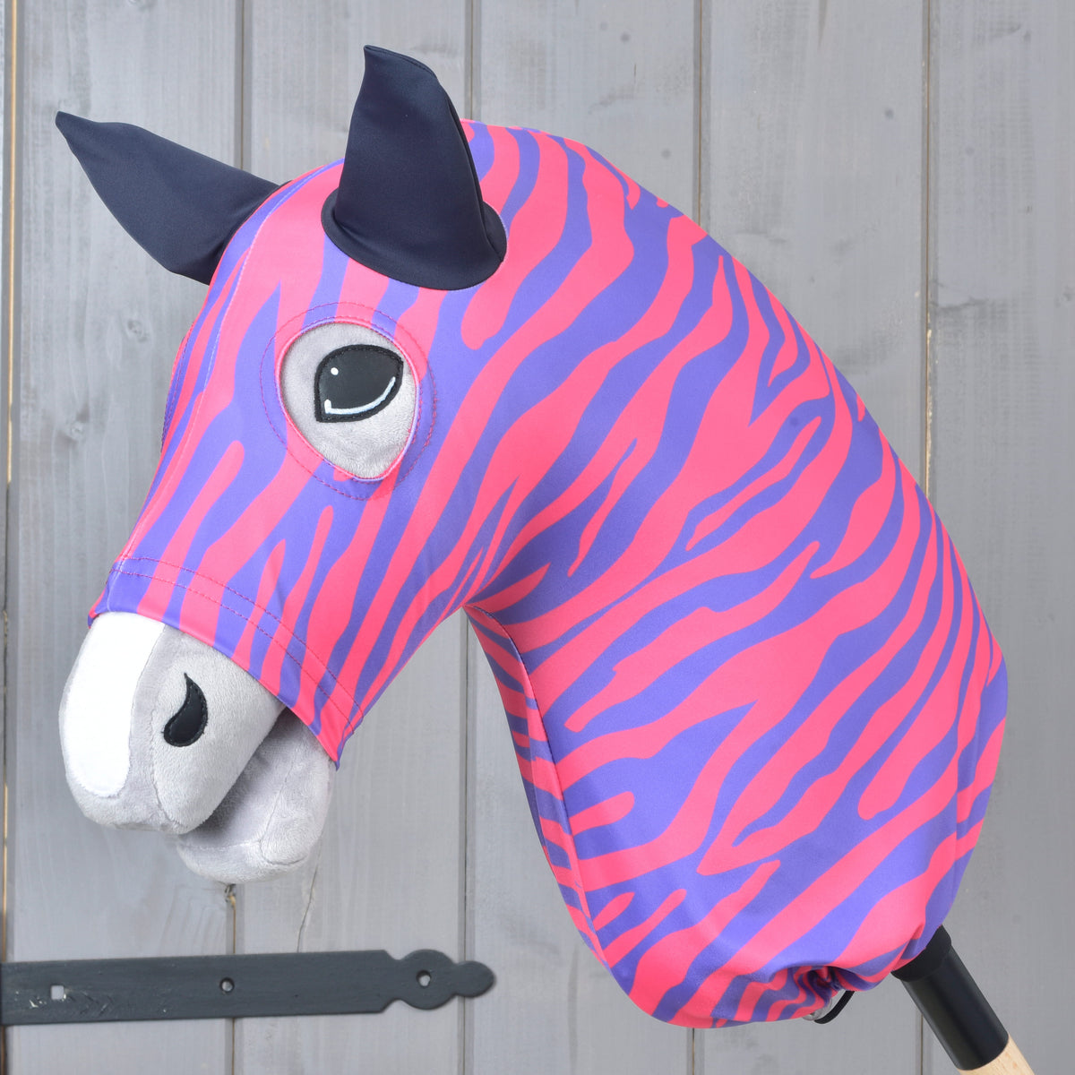 Hobby Horse protective suit Fancy by LarDen with pink and purple zebra stripes and navy ears, pulled over a grey head