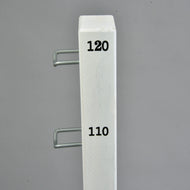 Close-up of the Hobby Horse jump: top of a white wing with height marks 110 and 120 and two metal pole holders