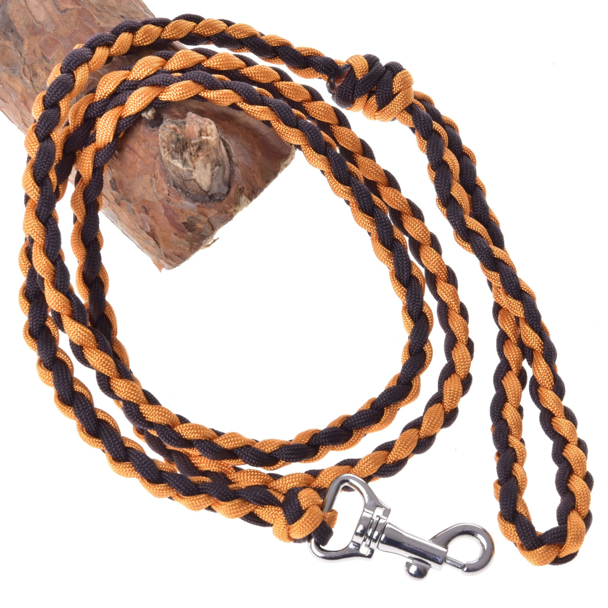 Hobby Horse Knitted Lead Rope Pomello by LarDen, braided orange and black cord with silver snap hook on a branch