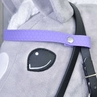 Close-up of the light purple honeycomb browband with silver rivet and black cheekpiece on a grey Hobby Horse