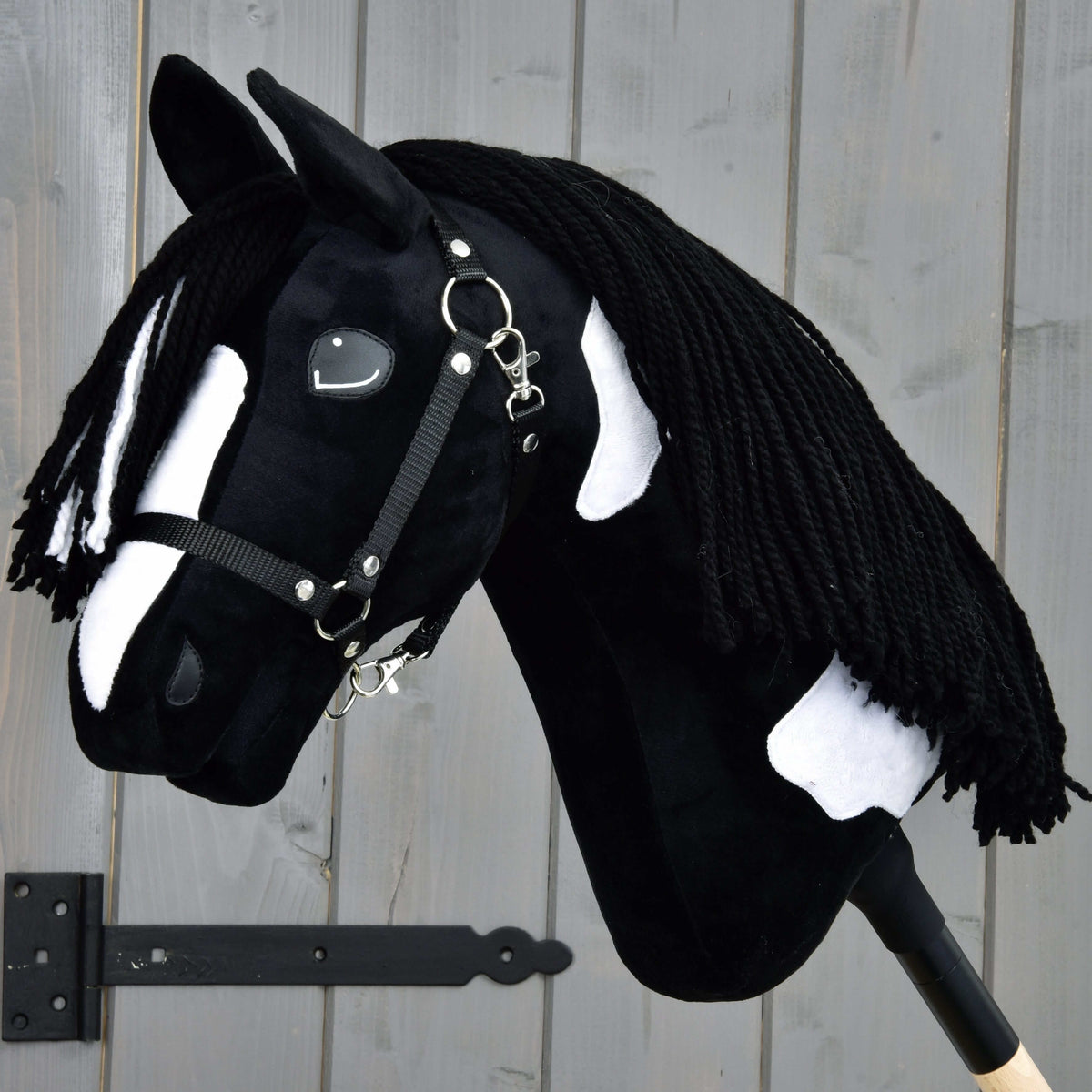 Hobby Horse Merlin with Black Halter by LarDen, black plush with a white blaze and patches and a long black yarn mane