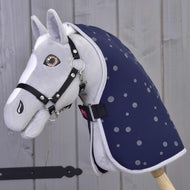 Grey plush Hobby Horse wearing the navy dotted Stable Blanket Night Sky with a black halter and chest strap