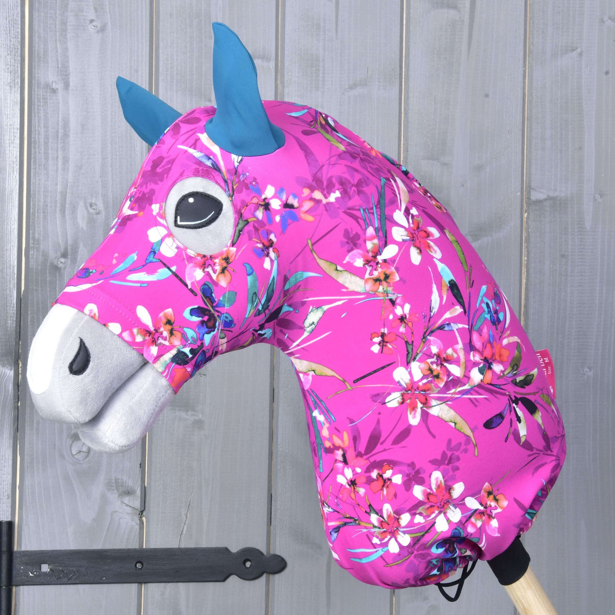 Hobby Horse protective suit Pink Beauty (Lycra) by LarDen on a grey head, magenta with watercolour flowers and teal ears