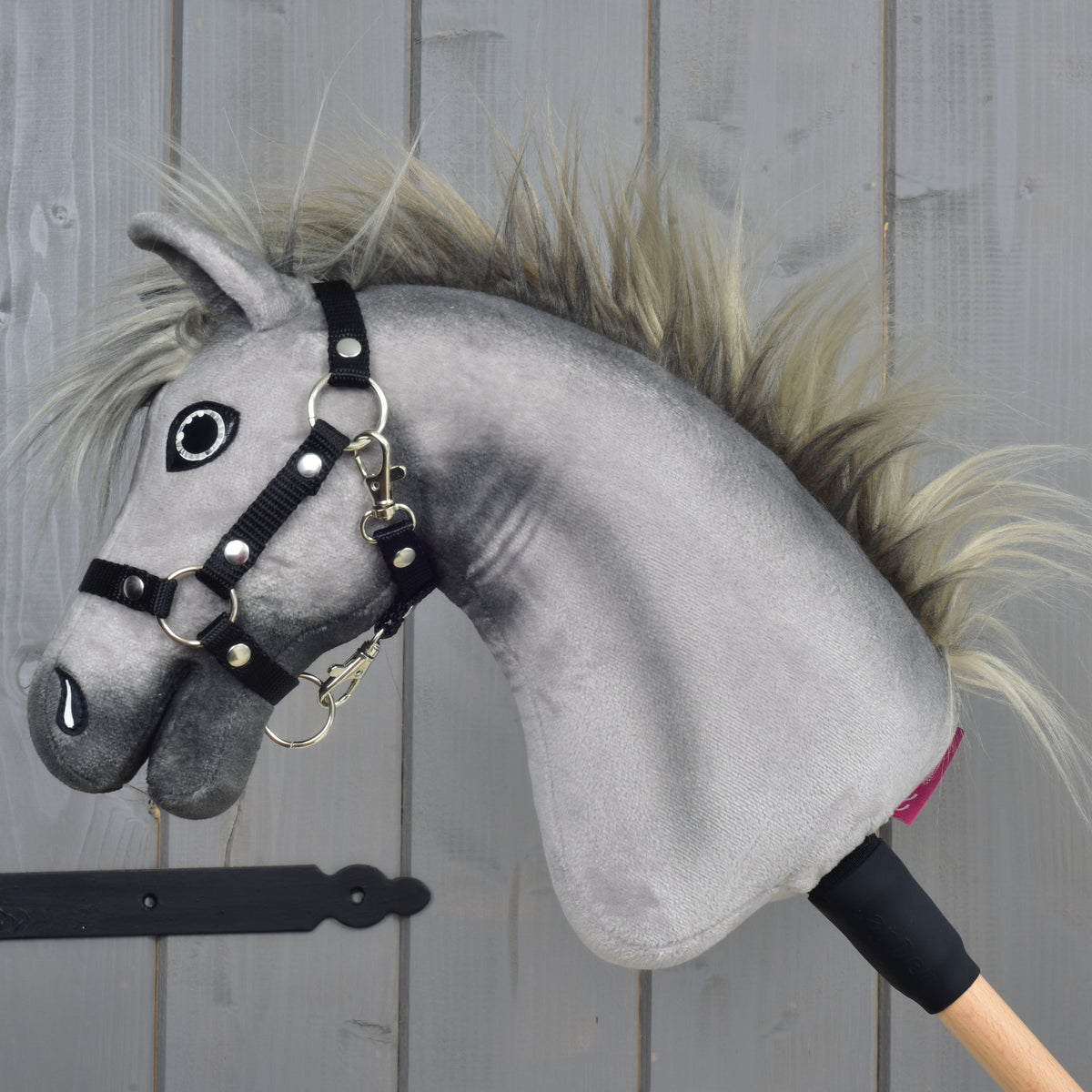 Hobby Horse Prestige in left profile, dark grey muzzle and the two-tone faux fur mane standing up along the neck