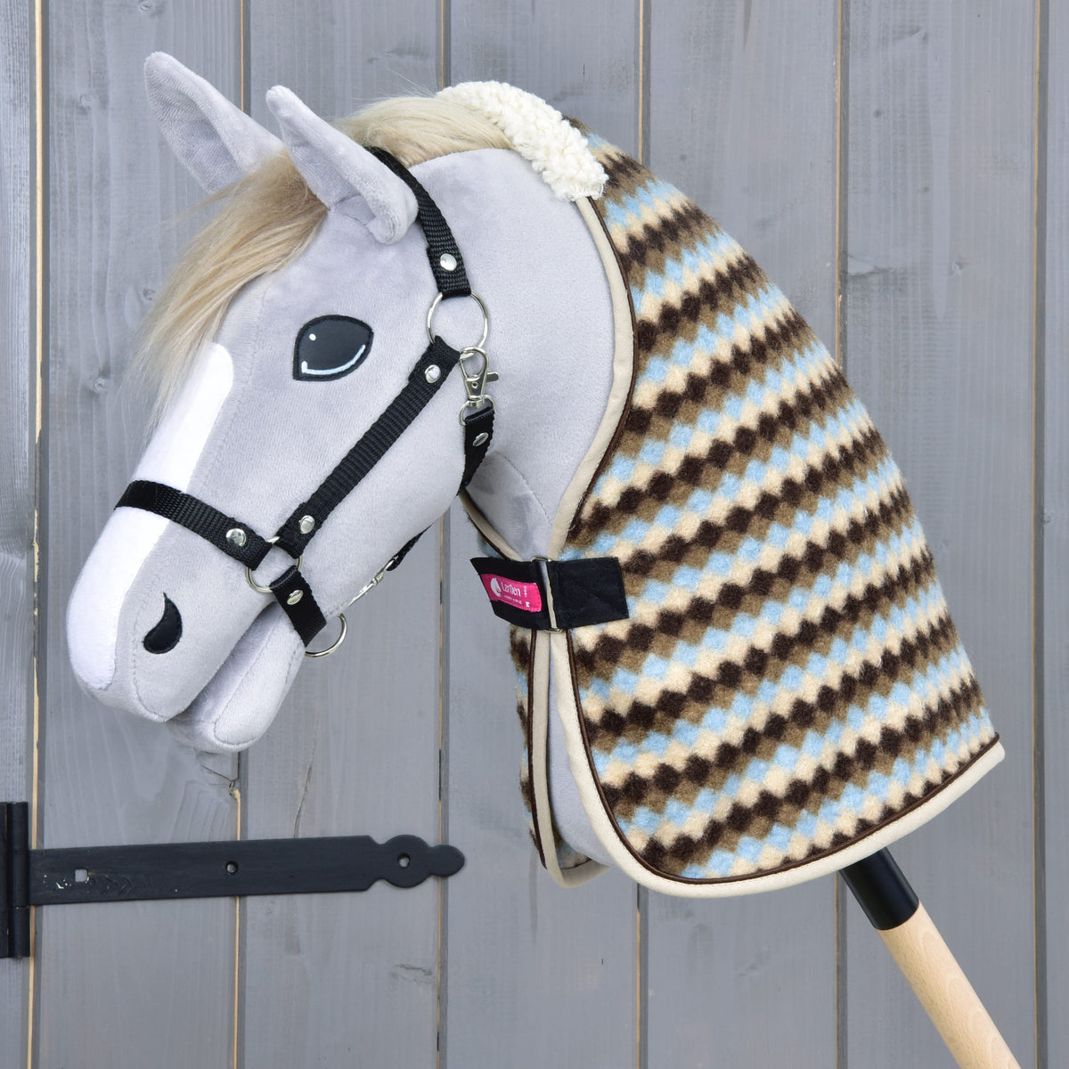 Grey Hobby Horse with a blond mane and black halter wearing the Stable Blanket Pastel Argyle with beige binding