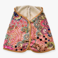 Hobby Horse couverture Jungle de LarDen à motif coloré de spirales et de points, doublure en peluche crème et bordure brun doré