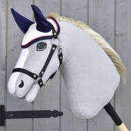 Grey plush Hobby Horse with a cream mane and black halter wearing the white ear bonnet with navy ears and pink trim