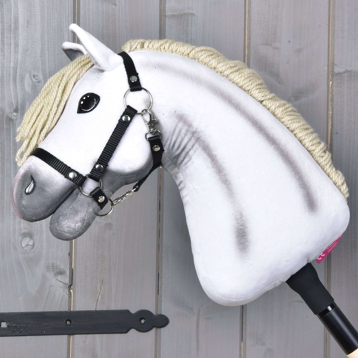 Hobby Horse Little Lady with Black Halter from the side, grey airbrushed shading on the white neck and a black stick