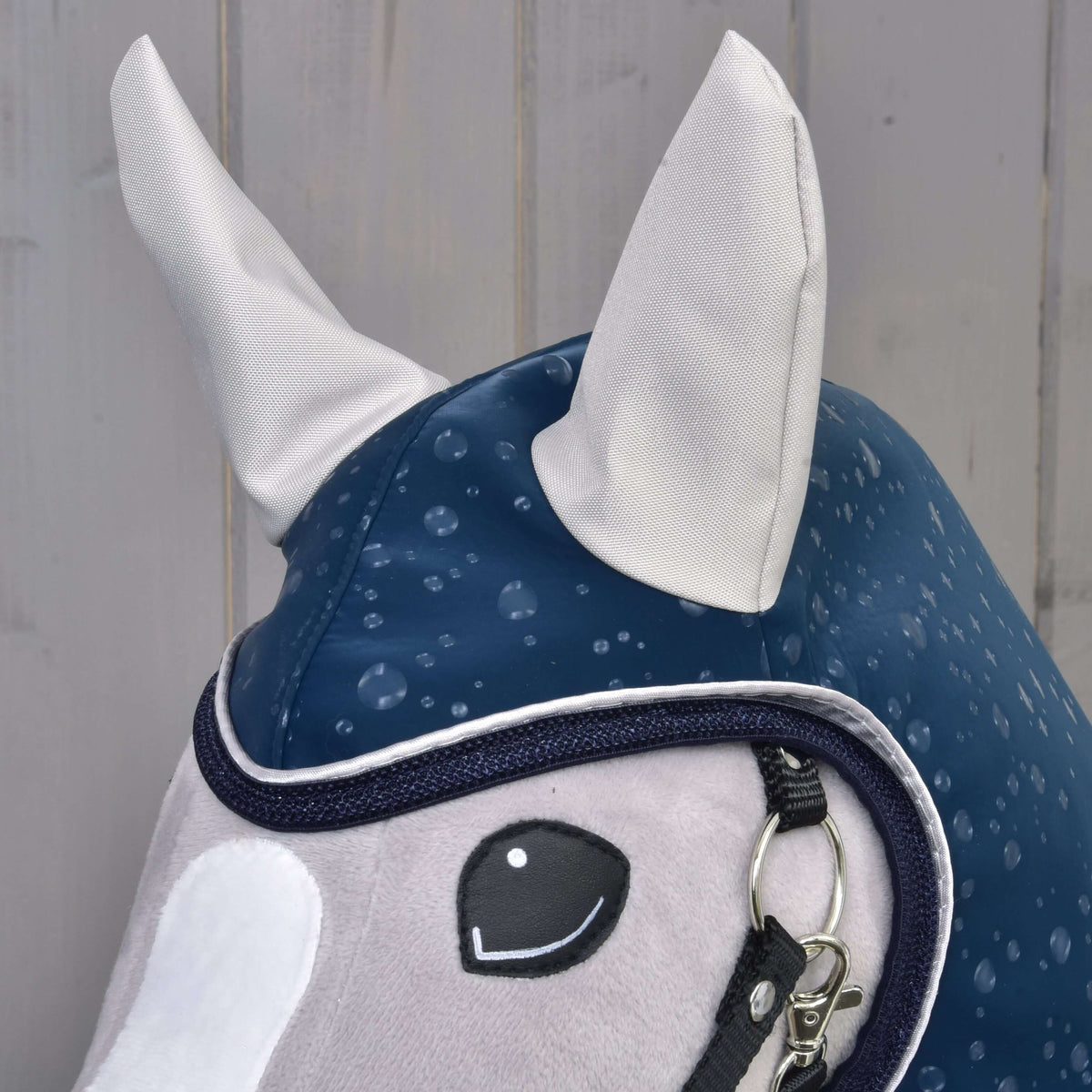 Close-up of the Hobby Horse Raincoat Derby hood with light grey ears and navy and white trim around the face