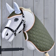 Light grey Hobby Horse in a black halter wearing the Set Moos, an olive green quilted blanket and matching ear bonnet