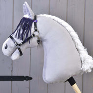 Halter black with lila fringes by LarDen on a grey plush Hobby Horse, the purple fringe hanging over its eye